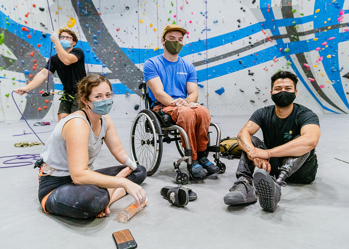 mo_blog-2 Pro climber, Maureen Beck, sits with two other paraclimbing athletes at Sender One LAX on Global Climbing Day.
