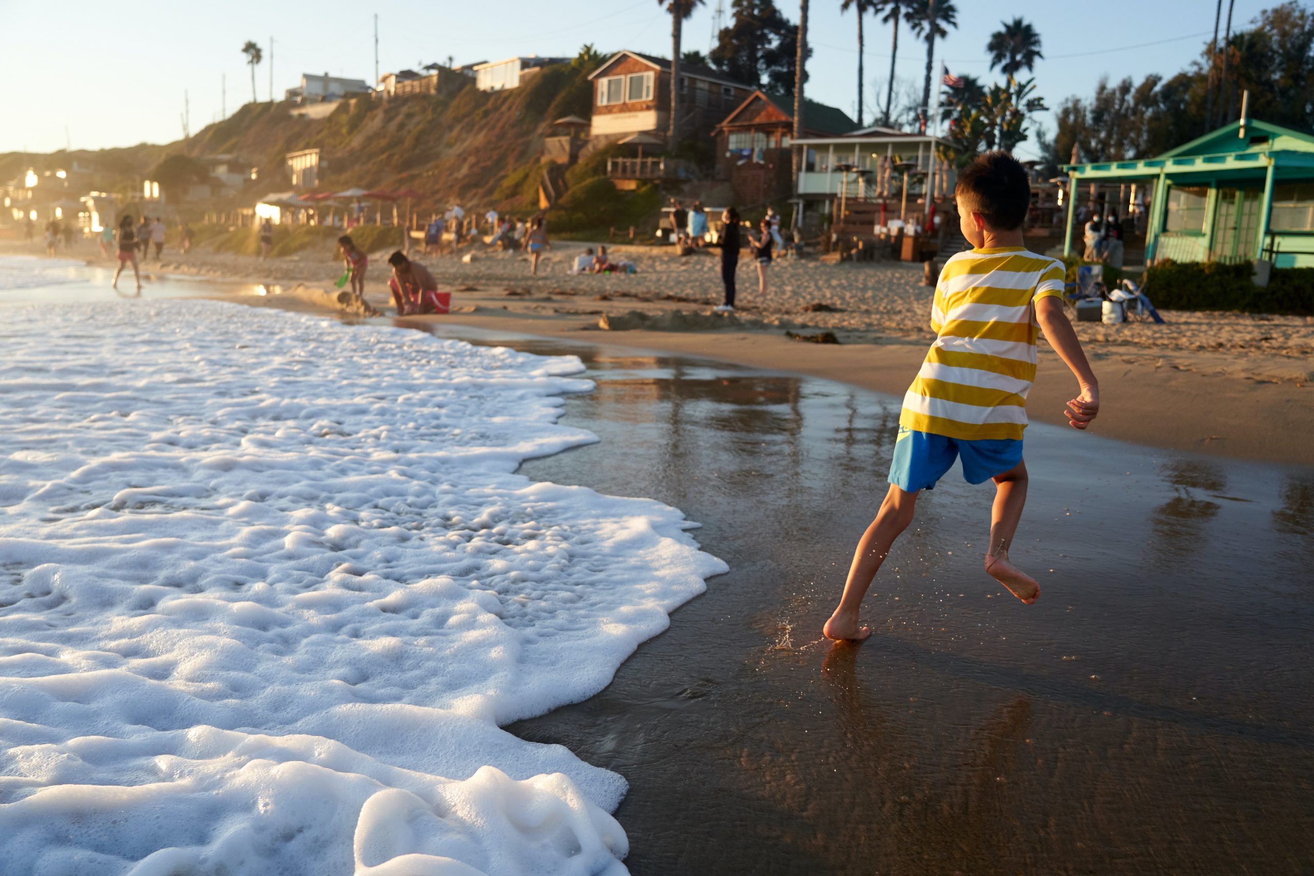Children play in the sands at Crystal Cove