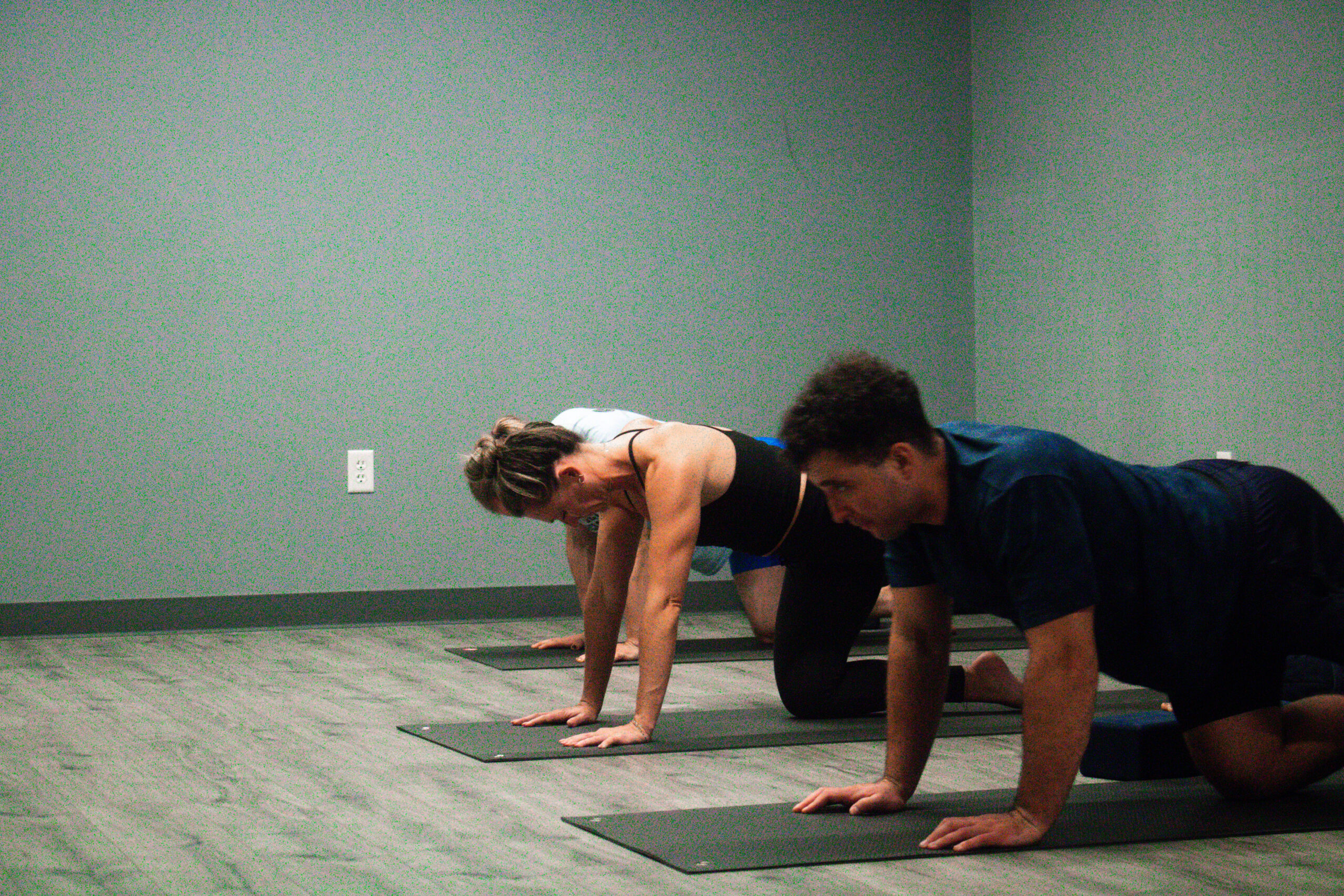 Group doing yoga in studio